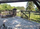 Cardinal's deck with a view of the bait and tackle shop and harbor.