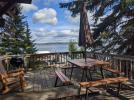 Deck with a picnic table, grill, chairs, and a beautiful view of Lake Vermilion.