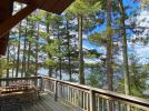 Deck area with picnic table, chairs, grill and great views of the lake.