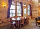 Dining room with large table and views of Lake Vermilion.