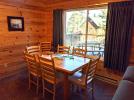 Dining room with seating for 6, plus extra chairs.