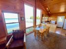 Open dining room with large windows facing Lake Vermilion.