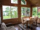 Spacious dining area surrounded on three sides with picture windows of beautiful Lake Vermilion.