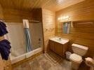 Downstairs bathroom with a standard tub and shower.