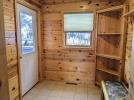 Large entry way with shelves, hooks and bench.