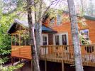 Exterior view of Spirit Wind's screen porch and deck.