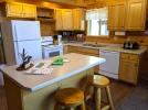 Kitchen with a standard refrigerator, stove and dishwasher.