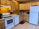 Kitchen with a standard stove, refrigerator, and dishwasher.