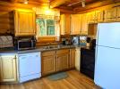 Kitchen with a standard refrigerator, stove and dishwasher.