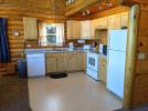 Kitchen with a standard refrigerator, stove and dishwasher.