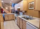 Kitchen with standard stove, refrigerator, and dishwasher.