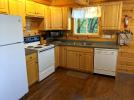 Kitchen with a standard refrigerator, stove and dishwasher.