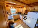 Kitchen with stove, refrigerator and dishwasher.