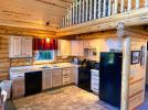 Kitchen with a standard stove, refrigerator and dishwasher.