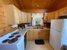 Kitchen with a stove, refrigerator and dishwasher.