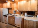 Kitchen with refrigerator, stove and dishwasher.