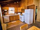 Kitchen with refrigerator, stove and dishwasher.