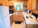 Kitchen with refrigerator, stove and dishwasher.