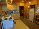 Kitchen with a standard stove, refrigerator and dishwasher.