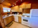 Kitchen with a stove, refrigerator, and dishwasher.