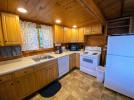 Kitchen with a standard stove, refrigerator and dishwasher.