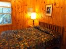 Small bedroom with a queen bed.