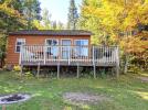 Lakeview cabin, nestled in the trees, with views of the beach and lake.