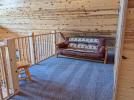 Loft area with a futon.