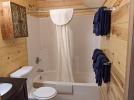 Upstairs bathroom with a standard tub shower.