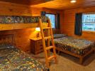 Bedroom with a double, twin, and a lofted twin above the twin bed.