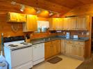 Kitchen with a standard refrigerator, stove, and dishwasher.