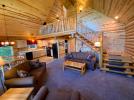 Open main floor showing the living room, dining room kitchen and loft.