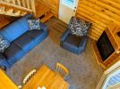 Living room with a couch, recliner, and gas fireplace.