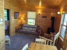 Living room with futon, chair and view of Lake Vermilion.