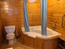 Loft bathroom with an oversized whirlpool tub.