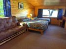 Loft bedroom with a queen and twin bed, and a futon.