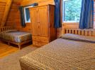 Loft bedroom with a queen and twin bed.