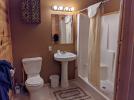 Main floor bathroom with wide doors and easy access shower and sink.