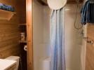 Main floor bathroom with accessible sink and easy access shower.