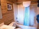Main floor bathroom with standard tub shower.