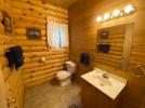 Main floor half bath with a sink and toilet.