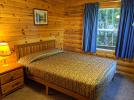 Main floor bedroom with a queen bed.