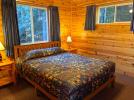 Main floor bedroom with a queen bed.