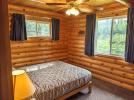 Main floor bedroom with a queen bed.