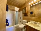 Master bathroom with standard tub and shower.