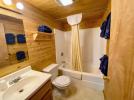 Master bathroom with standard tub and shower.