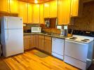 Kitchen with a standard refrigerator, stove and dishwasher.