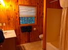 Upstairs bathroom with a standard tub shower.