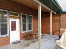 Deck area with a picnic table and views of the harbor.