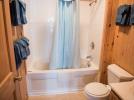 Upstairs bathroom with whirlpool tub and shower.